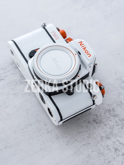 Nikon FM2 w/ 50mm f/1.4 Lens [White Orange Repaint]