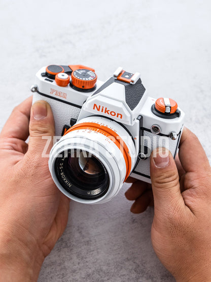 Nikon FM2 w/ 50mm f/1.4 Lens [White Orange Repaint]