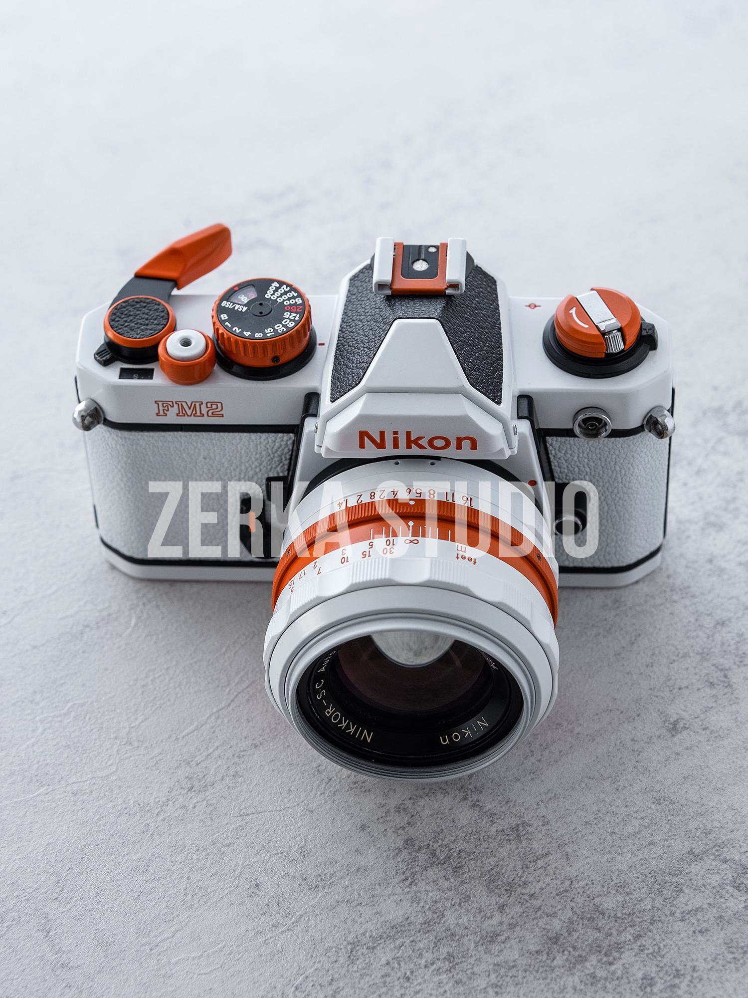 Nikon FM2 w/ 50mm f/1.4 Lens [White Orange Repaint]