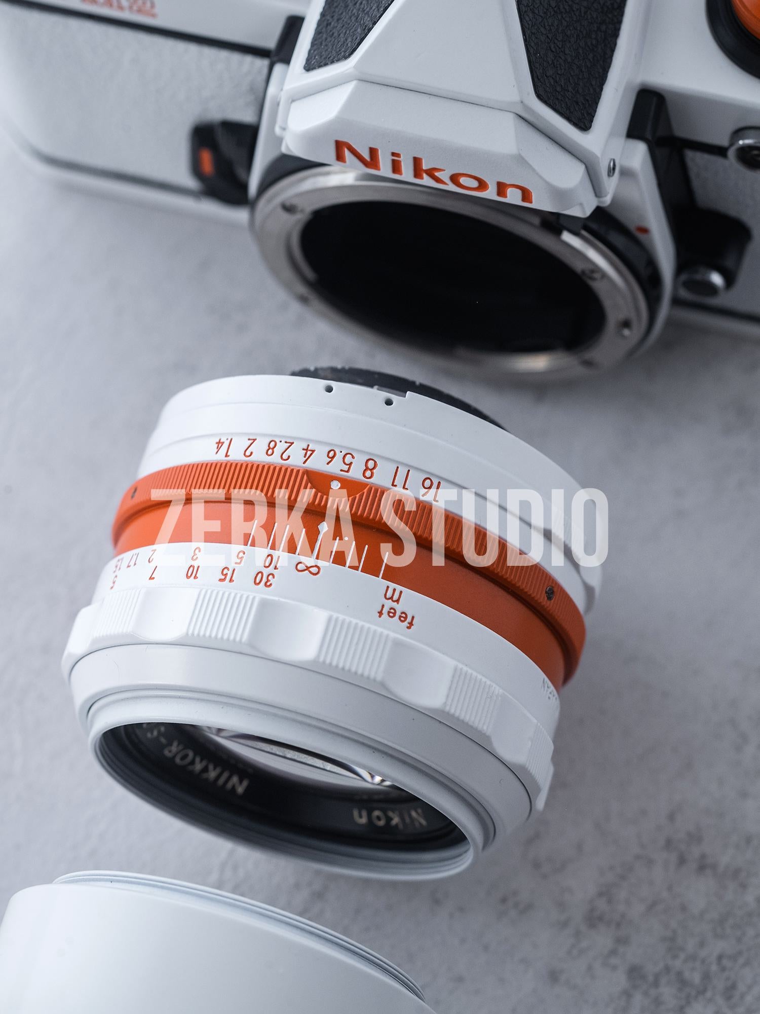 Nikon FM2 w/ 50mm f/1.4 Lens [White Orange Repaint]