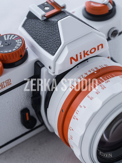 Nikon FM2 w/ 50mm f/1.4 Lens [White Orange Repaint]