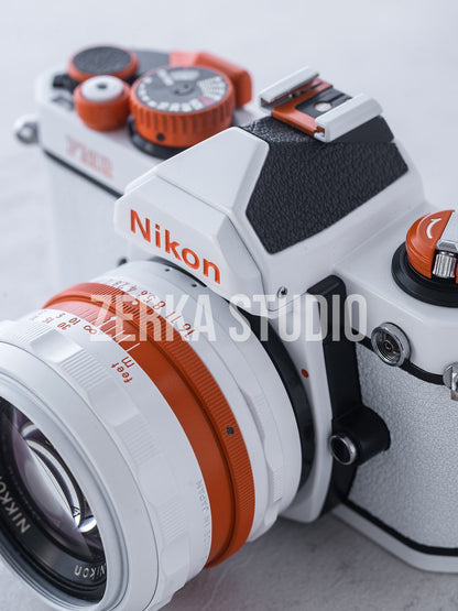 Nikon FM2 w/ 50mm f/1.4 Lens [White Orange Repaint]