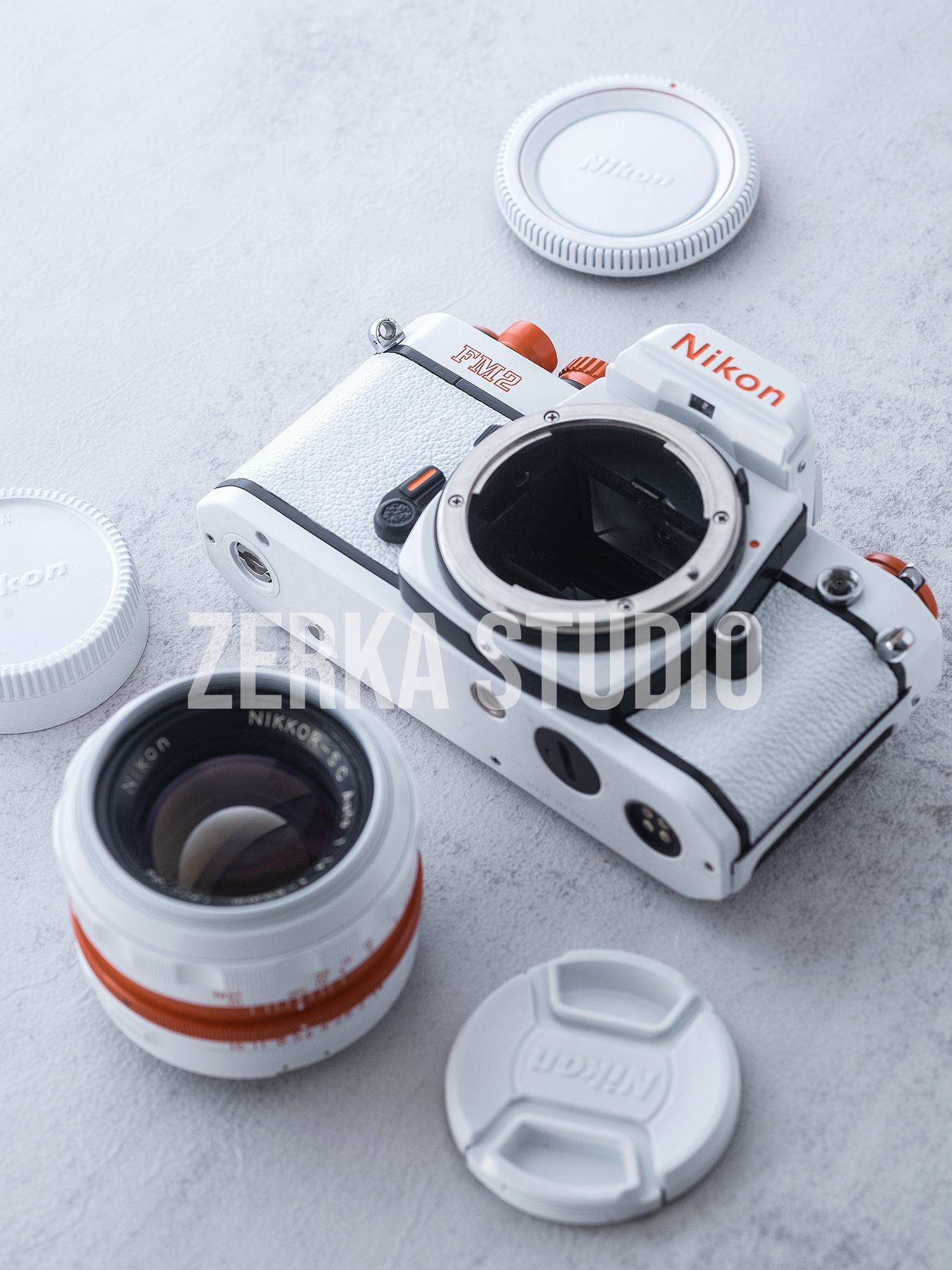 Nikon FM2 w/ 50mm f/1.4 Lens [White Orange Repaint]