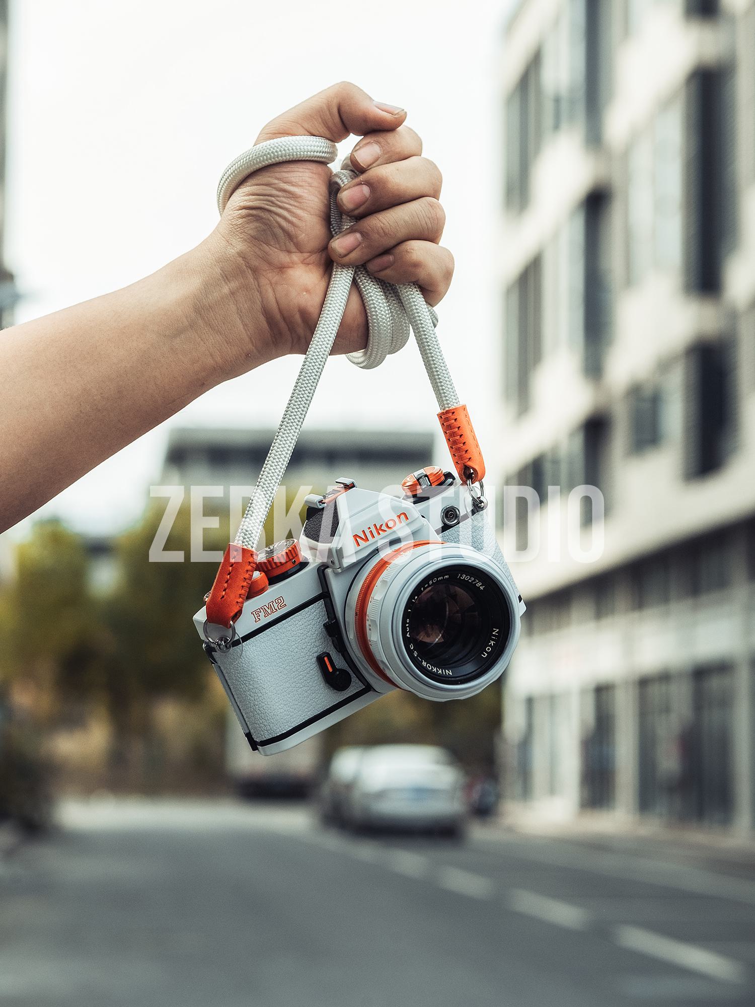 Nikon FM2 w/ 50mm f/1.4 Lens [White Orange Repaint]